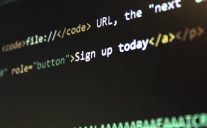 Detailed view of HTML and CSS code on a computer screen, concept of programming.